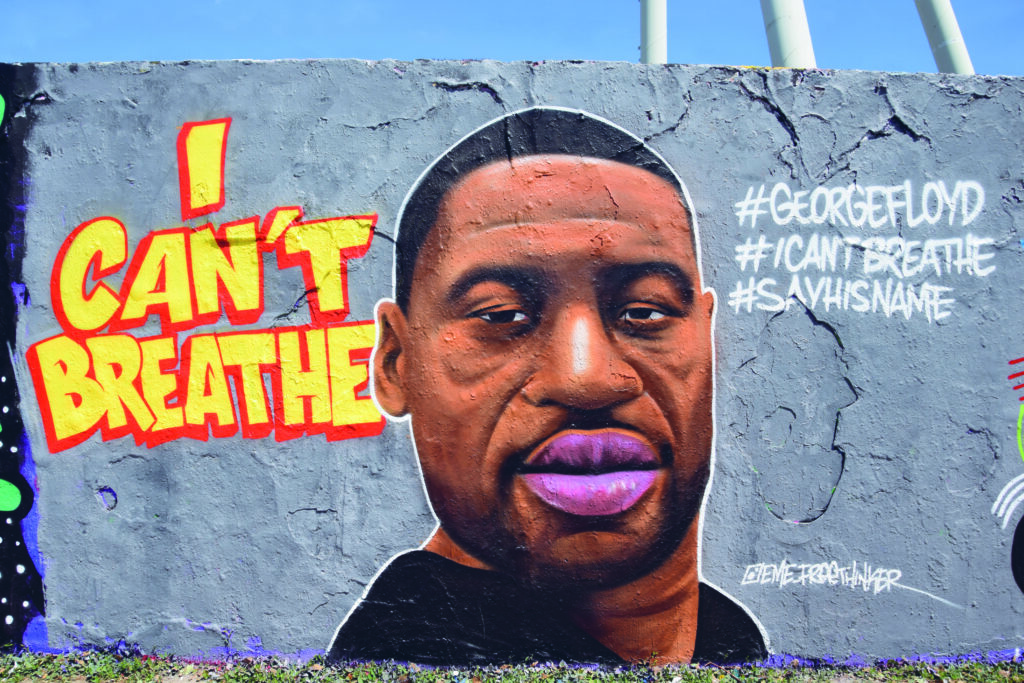 ein grafiti eines schwarzen mannes. daneben der schriftzug: i can´t breathe.
